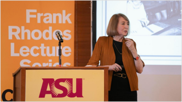 Cathy N. Davidson standing at a podium